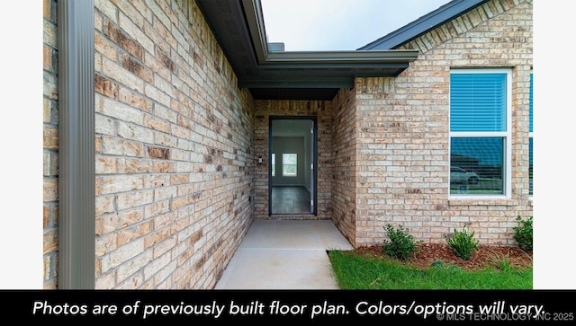 210 S 26th St, Collinsville, OK 74021 - view of exterior entry featuring brick siding