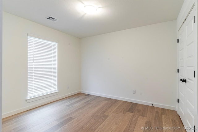 214 S 26th St, Collinsville, OK 74021 - spare room featuring light wood-style flooring and baseboards