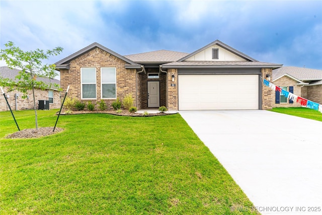 302 S 26th St, Collinsville, OK 74021 - ranch-style house with brick siding, an attached garage, driveway, and a front yard
