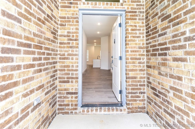 302 S 26th St, Collinsville, OK 74021 - doorway to property featuring brick siding