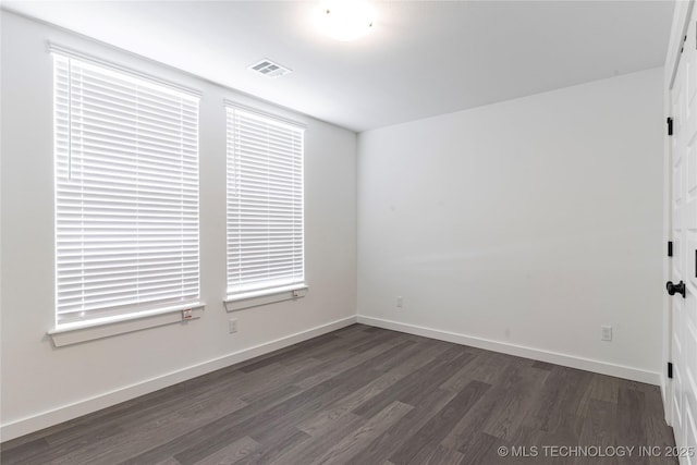 302 S 26th St, Collinsville, OK 74021 - empty room with dark wood-style floors and baseboards