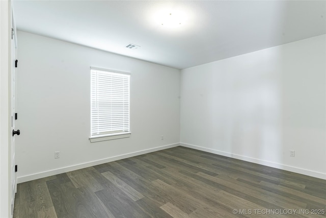 302 S 26th St, Collinsville, OK 74021 - empty room featuring dark wood-style flooring and baseboards