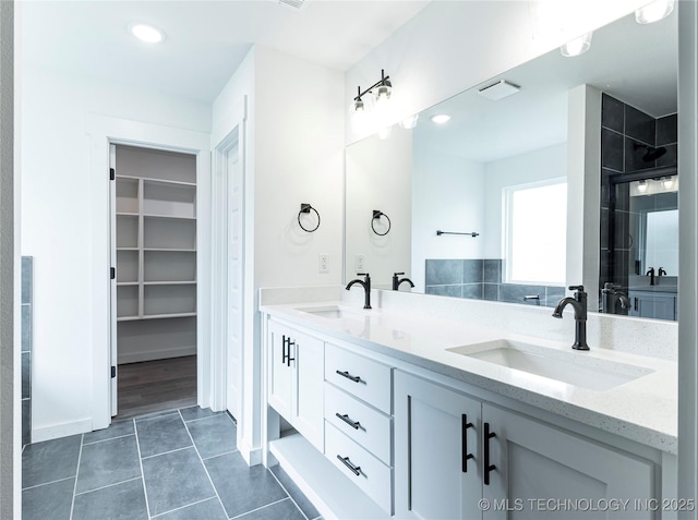 302 S 26th St, Collinsville, OK 74021 - full bath with double vanity, tile patterned floors, a tile shower, a walk in closet, and recessed lighting