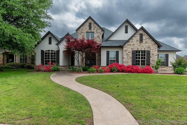 6009 W Utica Cir, Broken Arrow, OK 74011 - view of front facade featuring stone siding, stucco siding, a front lawn, and roof with shingles