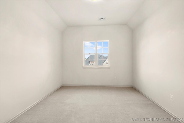 6009 W Utica Cir, Broken Arrow, OK 74011 - spare room featuring light carpet and lofted ceiling