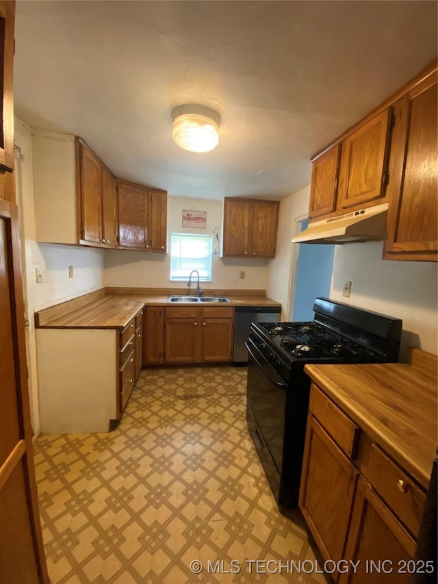 41 G SE, Ardmore, OK 73401 - kitchen with under cabinet range hood, black gas range oven, dishwasher, light floors, and butcher block countertops