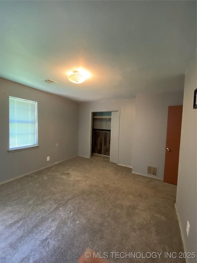 41 G SE, Ardmore, OK 73401 - carpeted empty room featuring baseboards