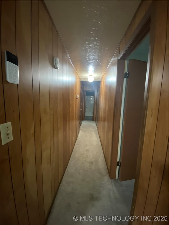 41 G SE, Ardmore, OK 73401 - hallway featuring wooden walls and light colored carpet