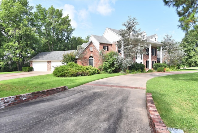 13706 S 18th St, Bixby, OK 74008 - greek revival inspired property featuring brick siding, driveway, a front lawn, and an attached garage