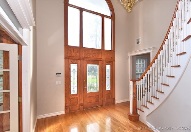 13706 S 18th St, Bixby, OK 74008 - entrance foyer with wood finished floors, stairs, a towering ceiling, and a chandelier