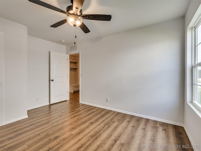 7202 E 132nd St S, Bixby, OK 74008 - empty room with wood finished floors and ceiling fan