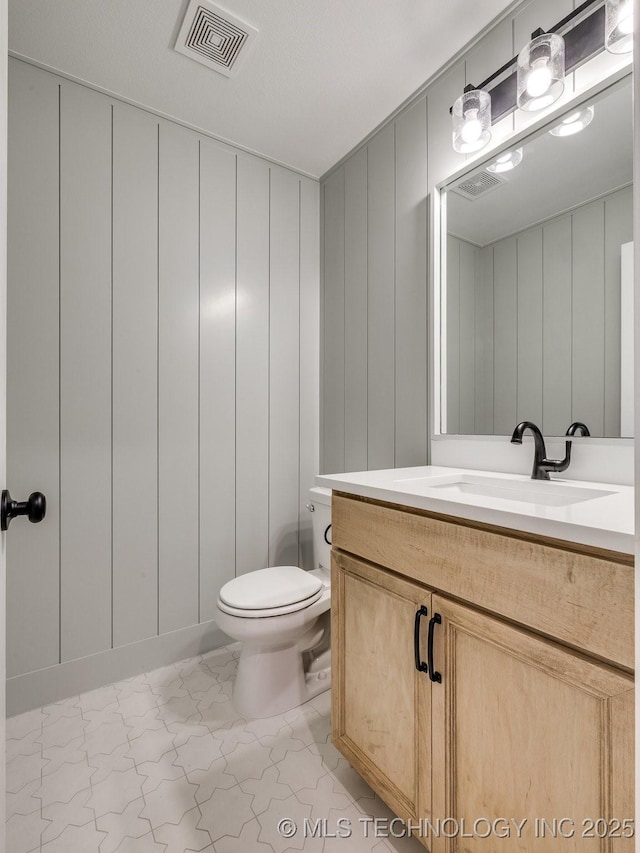 7202 E 132nd St S, Bixby, OK 74008 - bathroom with a decorative wall and vanity