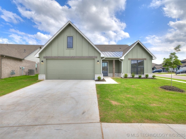 7202 E 132nd St S, Bixby, OK 74008 - view of front facade featuring board and batten siding, concrete driveway, a front lawn, and a standing seam roof