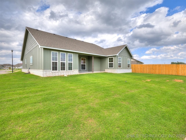 7202 E 132nd St S, Bixby, OK 74008 - back of property featuring a shingled roof, board and batten siding, and brick siding