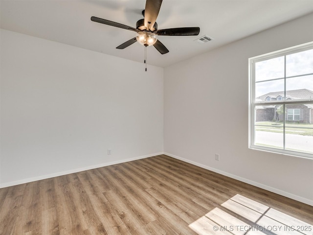 7202 E 132nd St S, Bixby, OK 74008 - empty room with healthy amount of natural light, light wood-style flooring, and a ceiling fan