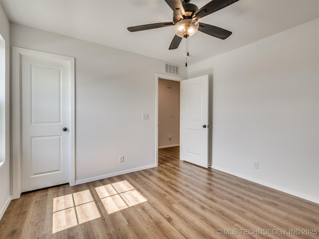 7202 E 132nd St S, Bixby, OK 74008 - empty room featuring wood finished floors and a ceiling fan