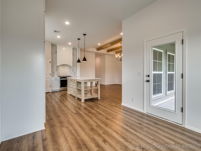 7202 E 132nd St S, Bixby, OK 74008 - unfurnished living room with wood finished floors, recessed lighting, beam ceiling, and a chandelier