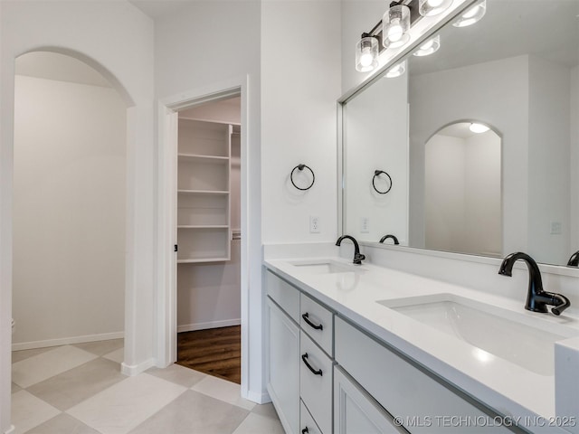 7202 E 132nd St S, Bixby, OK 74008 - bathroom featuring double vanity and a spacious closet