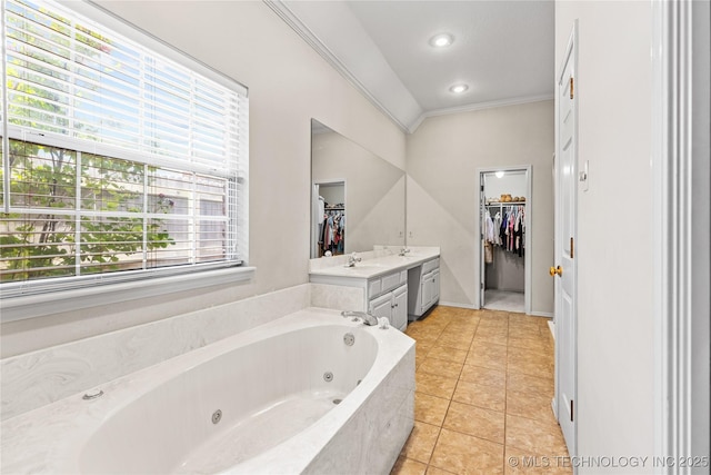 9810 E 96th Pl, Tulsa, OK 74133 - bathroom with a whirlpool tub, crown molding, vanity, a spacious closet, and tile patterned flooring