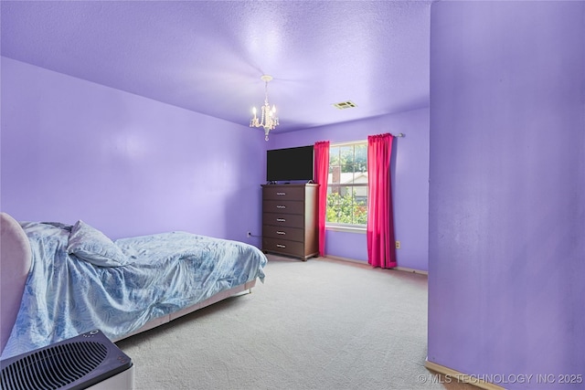 9810 E 96th Pl, Tulsa, OK 74133 - carpeted bedroom featuring a chandelier and a textured ceiling