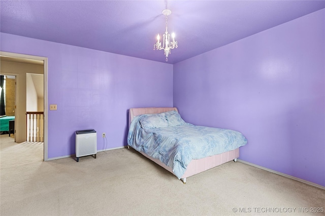 9810 E 96th Pl, Tulsa, OK 74133 - carpeted bedroom with a chandelier and baseboards