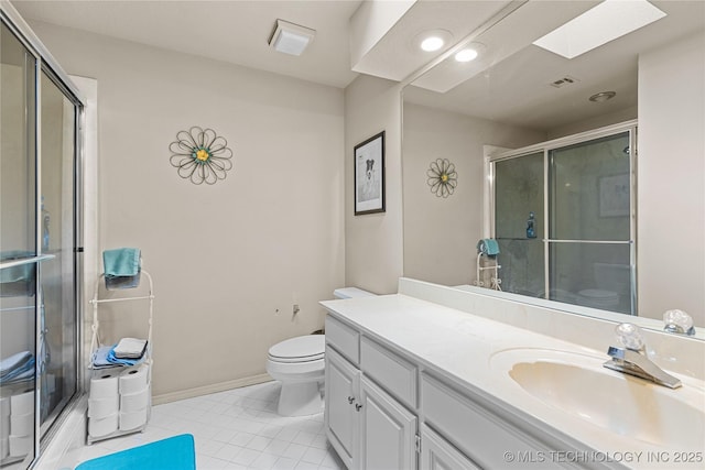 9810 E 96th Pl, Tulsa, OK 74133 - full bath featuring vanity, a shower with shower door, tile patterned floors, and a skylight