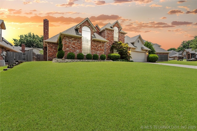9810 E 96th Pl, Tulsa, OK 74133 - view of front of property with brick siding, driveway, a shingled roof, and a garage