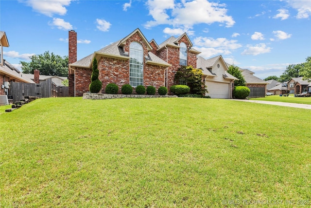 9810 E 96th Pl, Tulsa, OK 74133 - view of front of house with brick siding, driveway, a chimney, an attached garage, and roof with shingles
