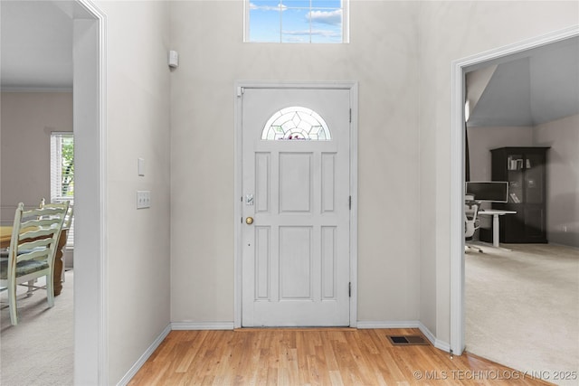 9810 E 96th Pl, Tulsa, OK 74133 - foyer featuring plenty of natural light and light wood-style floors