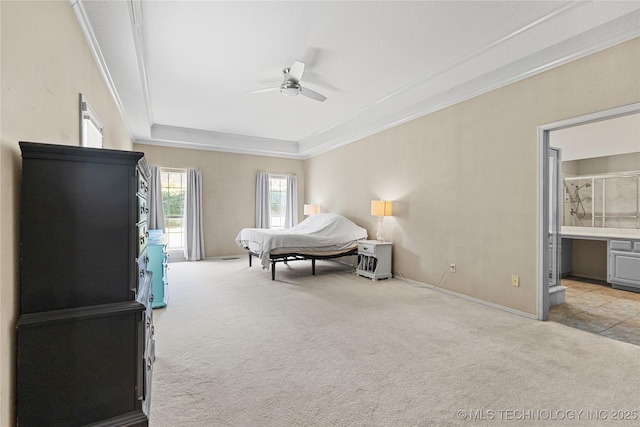 9810 E 96th Pl, Tulsa, OK 74133 - bedroom with light carpet, ornamental molding, a tray ceiling, ceiling fan, and ensuite bathroom