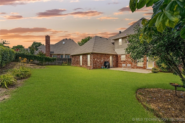 9810 E 96th Pl, Tulsa, OK 74133 - fenced backyard featuring a patio