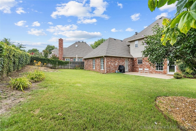 9810 E 96th Pl, Tulsa, OK 74133 - fenced backyard with a patio area