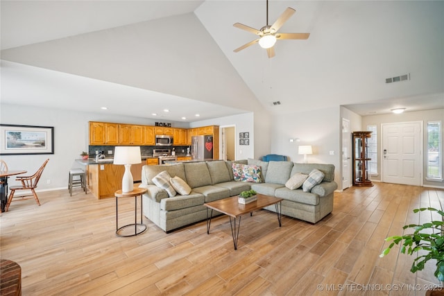 1600 S Ironwood Ave, Broken Arrow, OK 74012 - living room featuring high vaulted ceiling, light wood-style flooring, ceiling fan, and recessed lighting