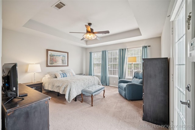 1600 S Ironwood Ave, Broken Arrow, OK 74012 - carpeted bedroom with a raised ceiling and ceiling fan