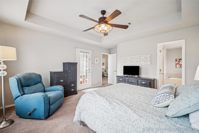 1600 S Ironwood Ave, Broken Arrow, OK 74012 - bedroom featuring a tray ceiling, carpet, a ceiling fan, and ensuite bathroom