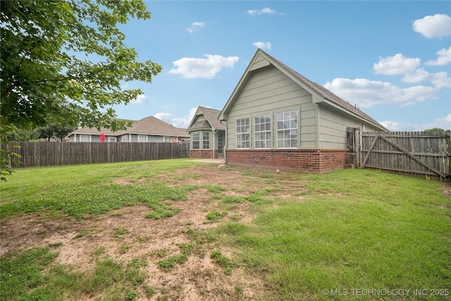 1600 S Ironwood Ave, Broken Arrow, OK 74012 - back of house featuring brick siding and a fenced backyard