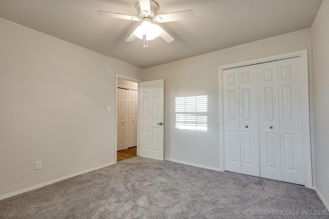 2520 Arlington Blvd, Ada, OK 74820 - unfurnished bedroom featuring carpet, a closet, and a ceiling fan