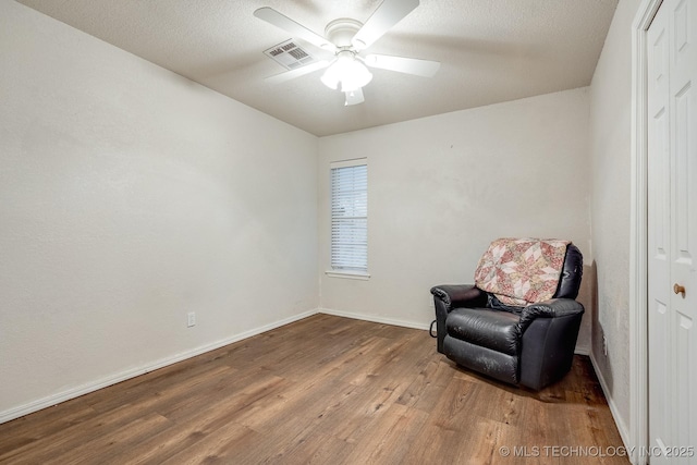 2520 Arlington Blvd, Ada, OK 74820 - sitting room featuring wood finished floors and ceiling fan