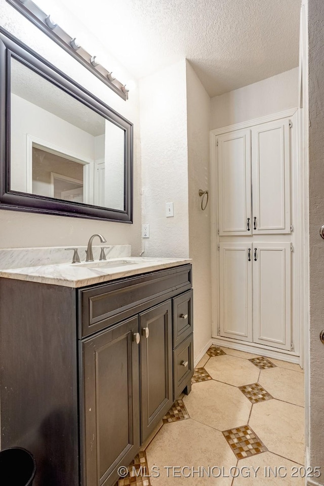 2520 Arlington Blvd, Ada, OK 74820 - bathroom featuring vanity and a textured ceiling