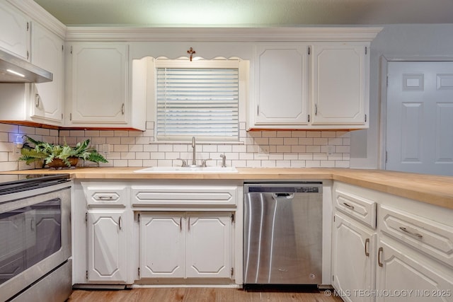2520 Arlington Blvd, Ada, OK 74820 - kitchen featuring stainless steel appliances, butcher block counters, decorative backsplash, and light wood finished floors