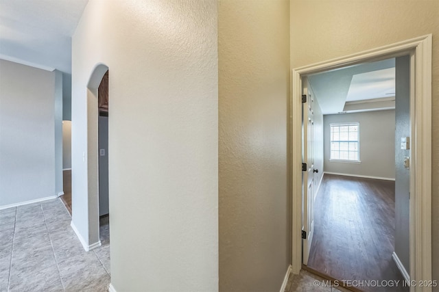 12003 S Tamarack St W, Jenks, OK 74037 - hall with arched walkways and a textured wall