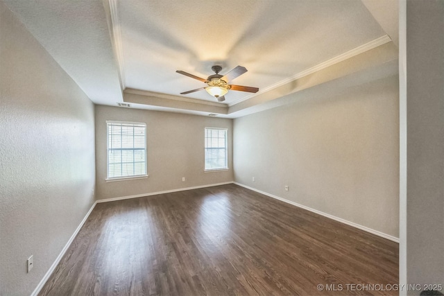 12003 S Tamarack St W, Jenks, OK 74037 - unfurnished room featuring a tray ceiling, ornamental molding, ceiling fan, and dark wood-style flooring