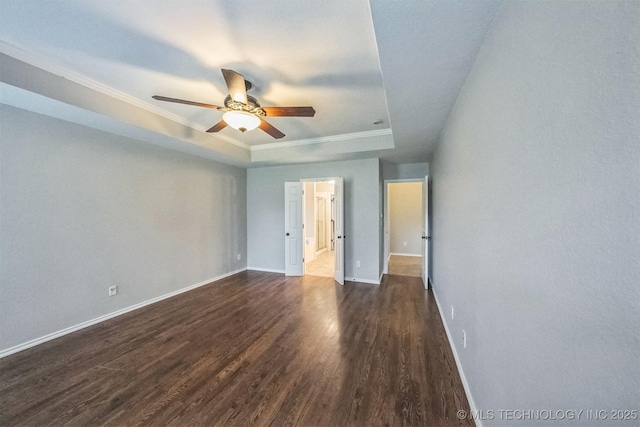 12003 S Tamarack St W, Jenks, OK 74037 - unfurnished bedroom with a raised ceiling, dark wood finished floors, ornamental molding, connected bathroom, and ceiling fan