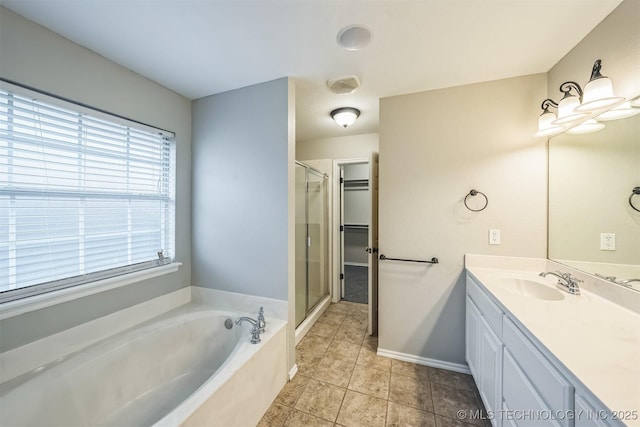 12003 S Tamarack St W, Jenks, OK 74037 - bathroom featuring a bath, vanity, a shower stall, and tile patterned floors