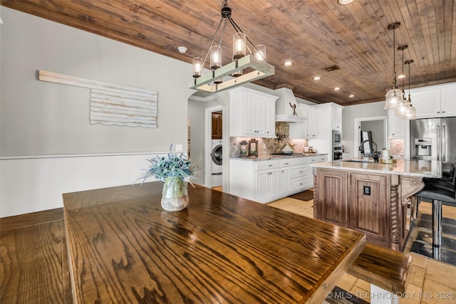 6108 E 95th St, Sperry, OK 74073 - dining space with wooden ceiling, washer / clothes dryer, a chandelier, recessed lighting, and arched walkways