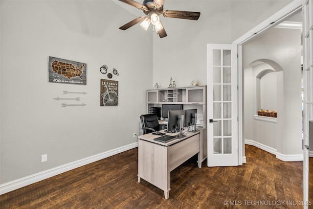 6108 E 95th St, Sperry, OK 74073 - home office featuring wood finished floors, ceiling fan, french doors, and arched walkways