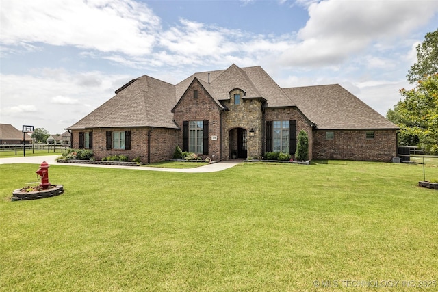 6108 E 95th St, Sperry, OK 74073 - french provincial home with a shingled roof and brick siding