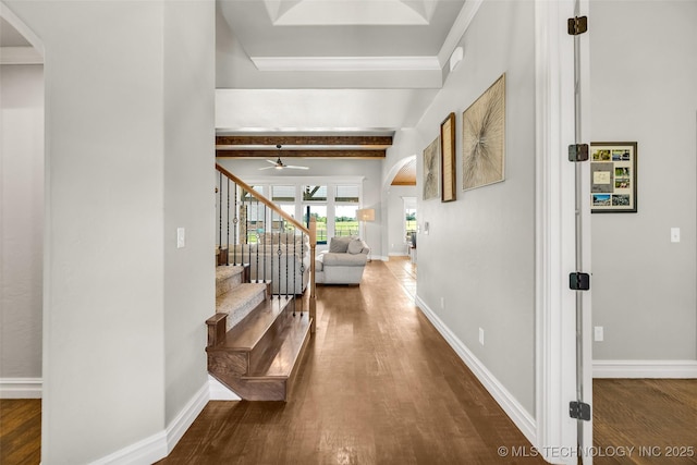 6108 E 95th St, Sperry, OK 74073 - foyer entrance featuring arched walkways, wood finished floors, beam ceiling, stairway, and ceiling fan