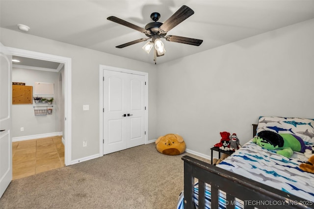 6108 E 95th St, Sperry, OK 74073 - tiled bedroom with a ceiling fan and carpet flooring