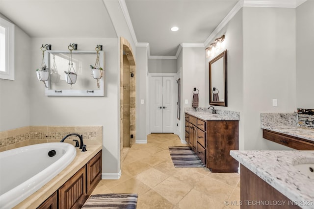 6108 E 95th St, Sperry, OK 74073 - full bathroom with two vanities, a shower stall, crown molding, a garden tub, and tile patterned floors